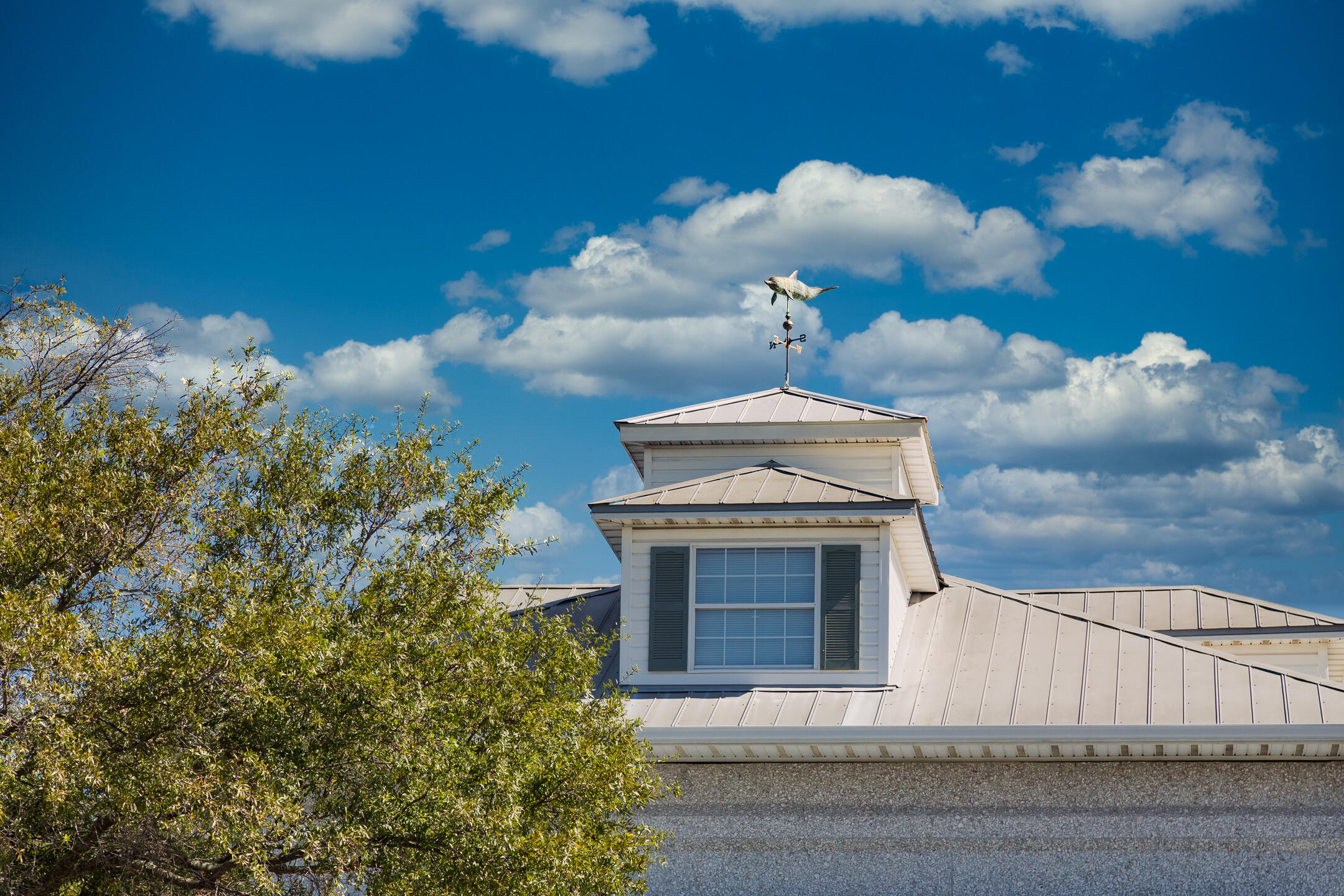 metal roof on house with blue sky background